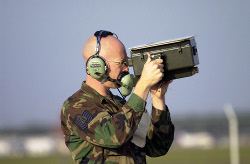 An aircraft's IFF transponder being read from the ground, which is a form of active RFID.